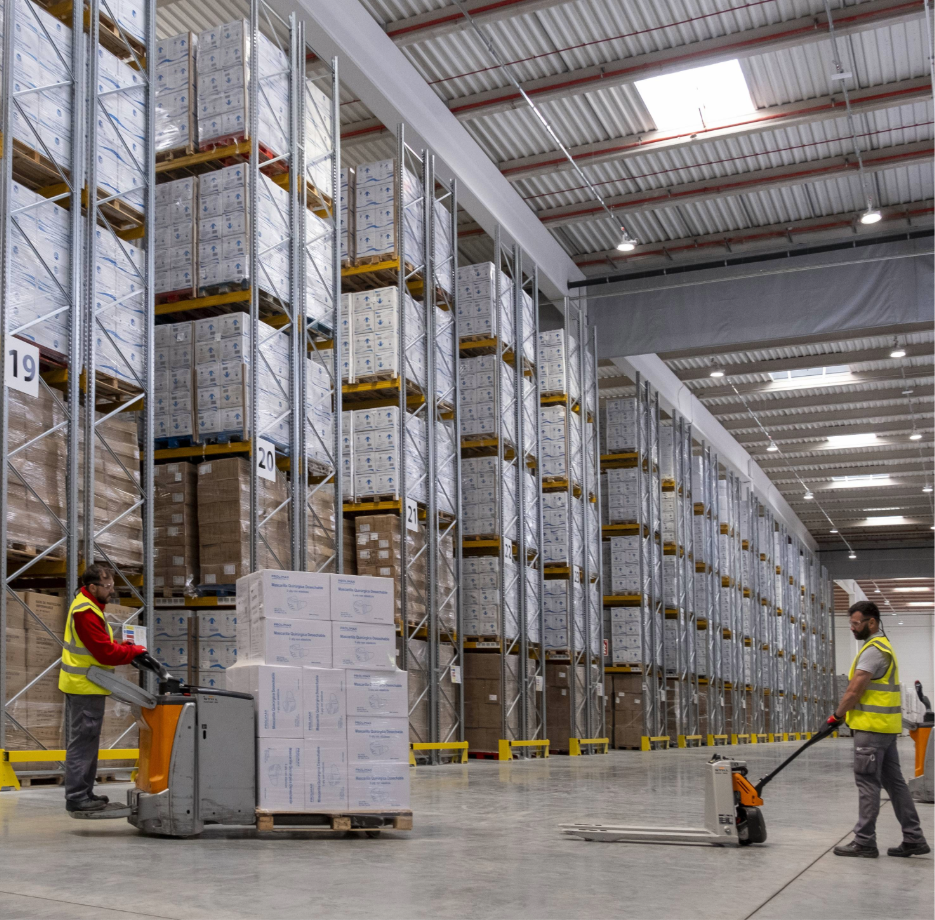 Standard warehouse racking system with tall metal shelves for pallet storage.