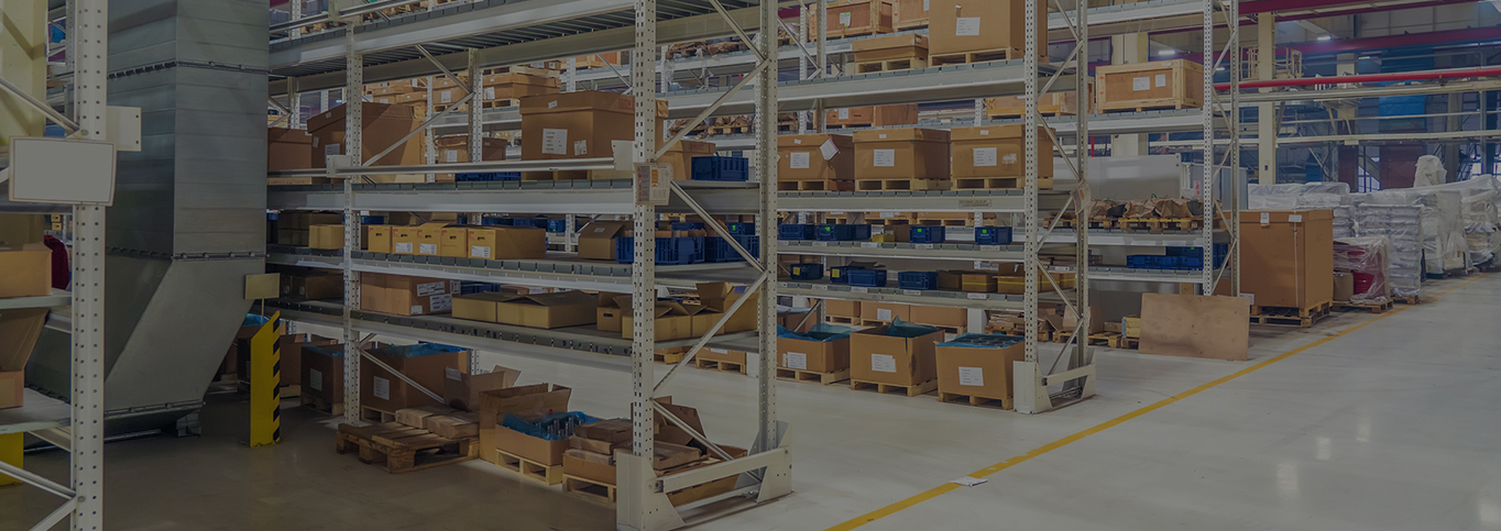 Image of warehouse with shelves and racking and thousands of automotive parts.