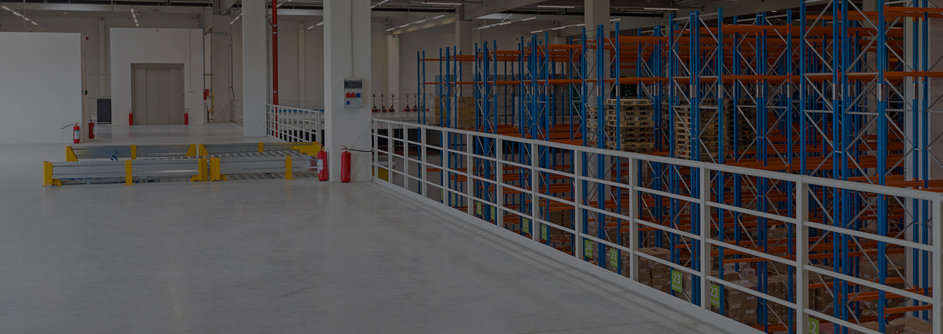 Warehouse with Mezzanine floor with racking below.