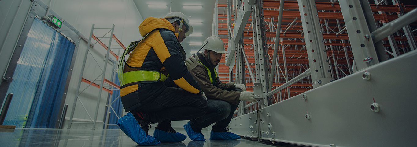 Two guys inspecting a warehouse